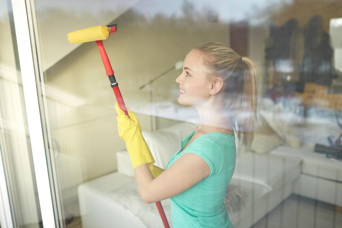 interior window cleaning near me. Woman cleans interior windows!